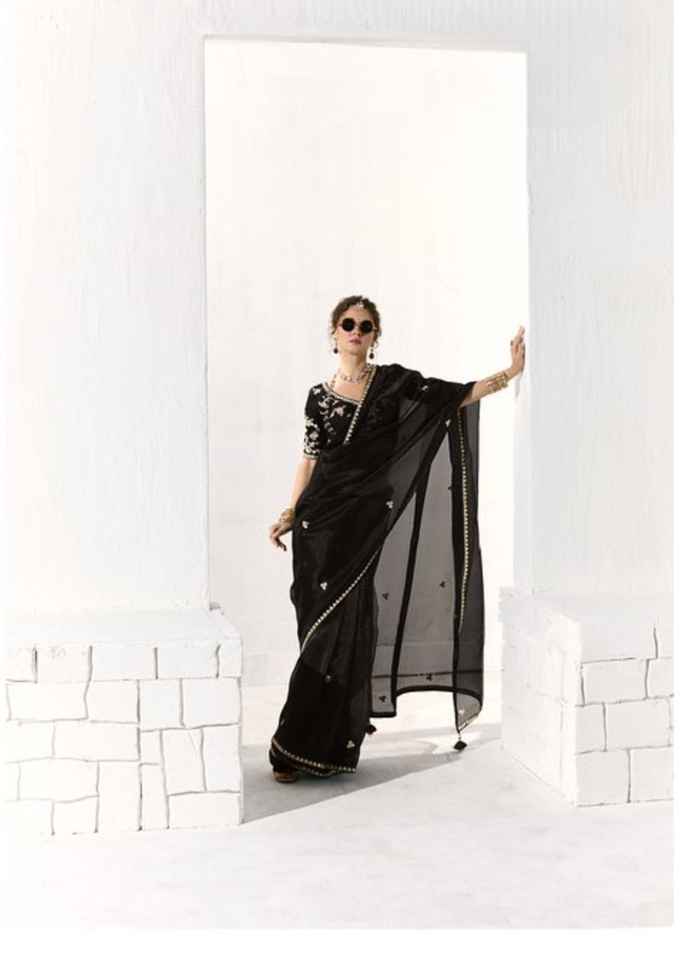 Krishna Ratri-Midnight black elegance adorned with golden buttas organza tissue saree