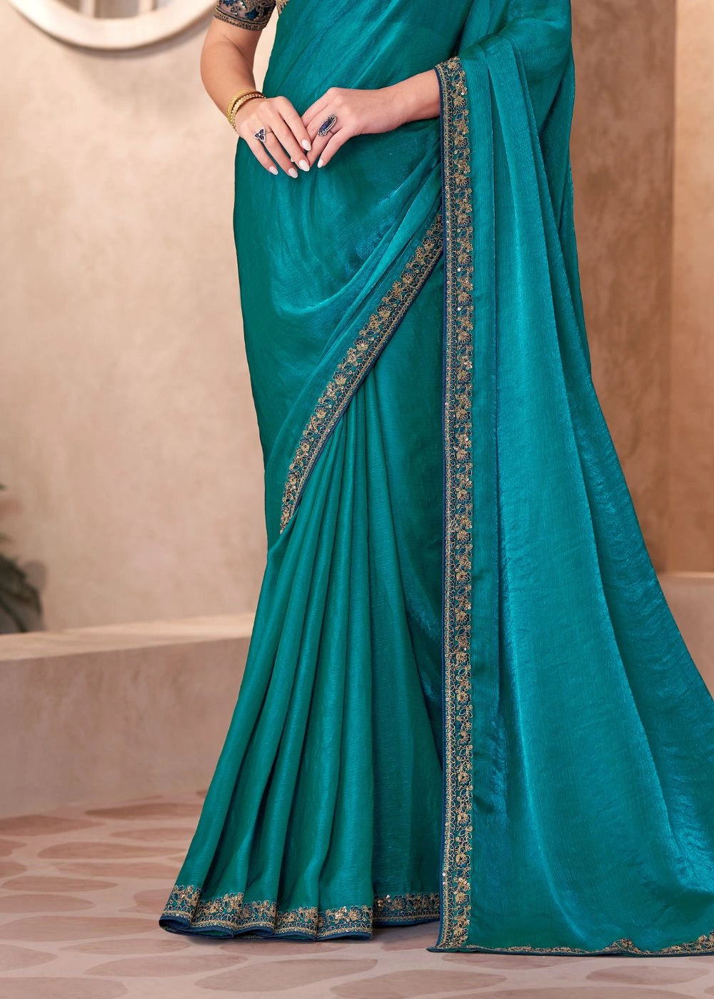 Teal Blue Satin Chiffon Saree with Rich Embroidered Border