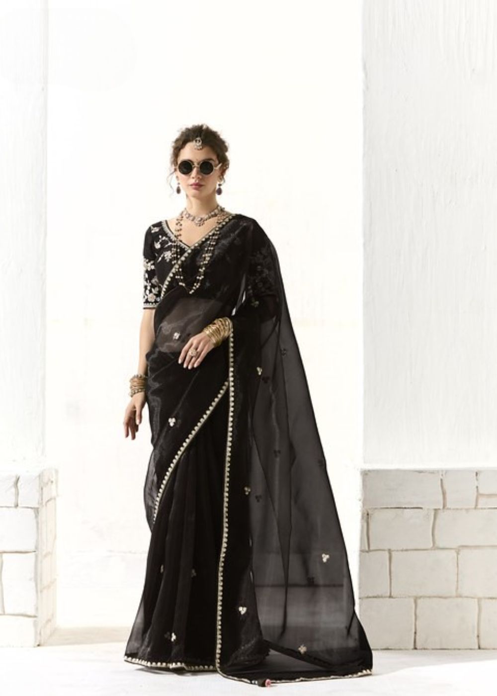 Krishna Ratri-Midnight black elegance adorned with golden buttas organza tissue saree