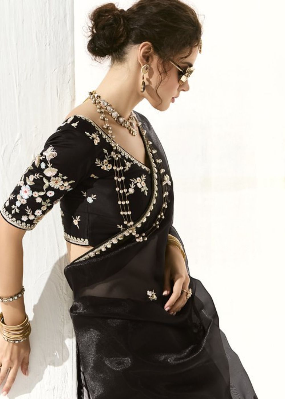 Krishna Ratri-Midnight black elegance adorned with golden buttas organza tissue saree