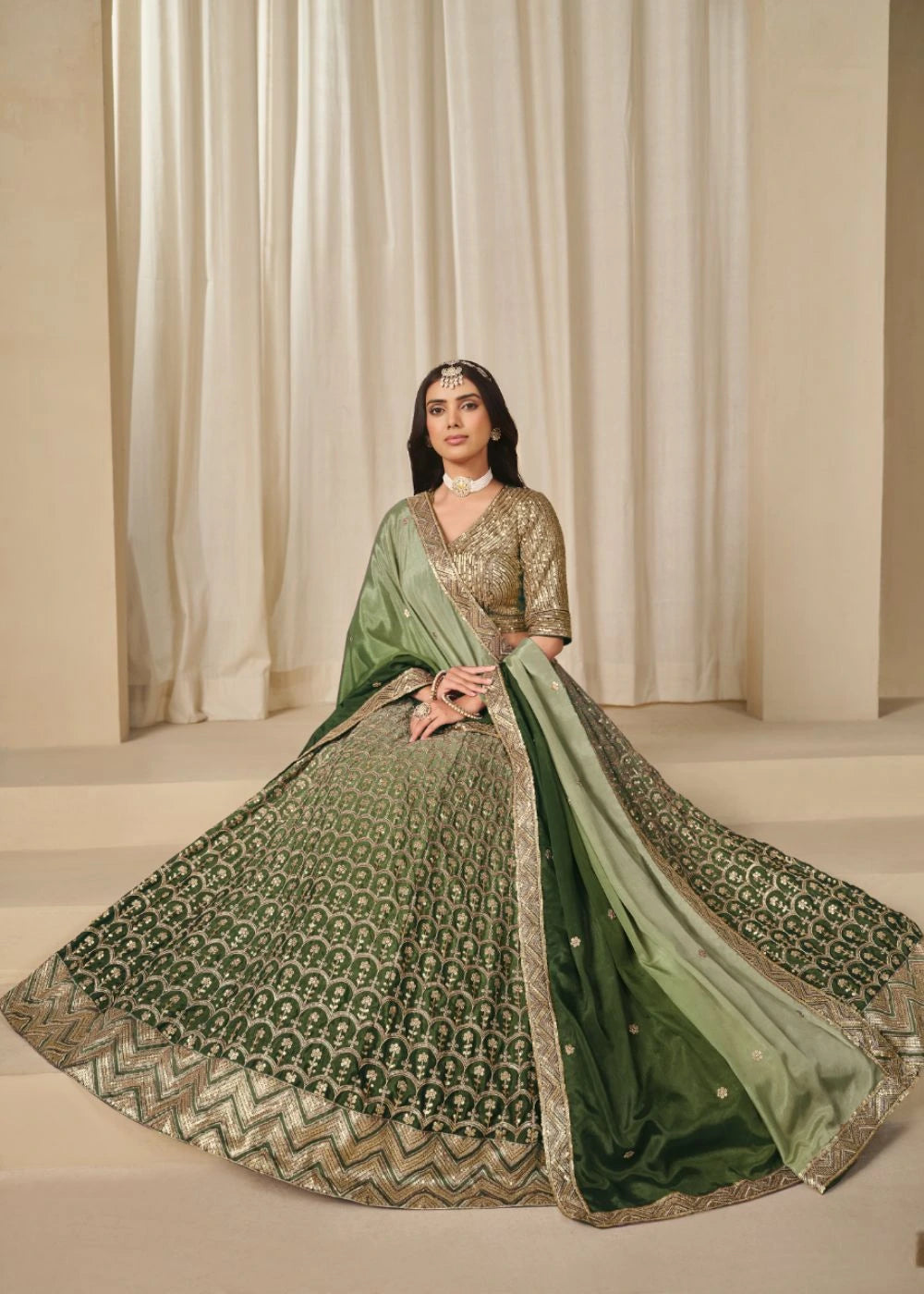 Emerald Royalty – Enchanted Green Chinon Silk Lehenga with Golden Zari Grandeur