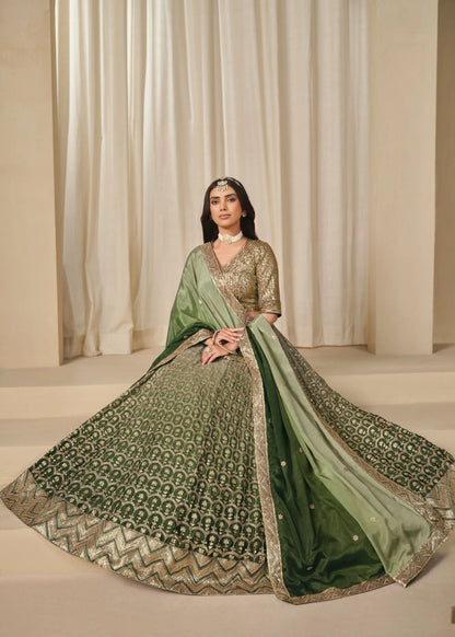 Emerald Royalty – Enchanted Green Chinon Silk Lehenga with Golden Zari Grandeur