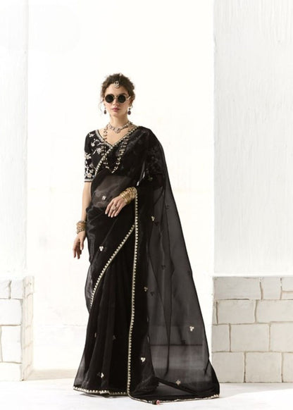 Krishna Ratri-Midnight black elegance adorned with golden buttas organza tissue saree