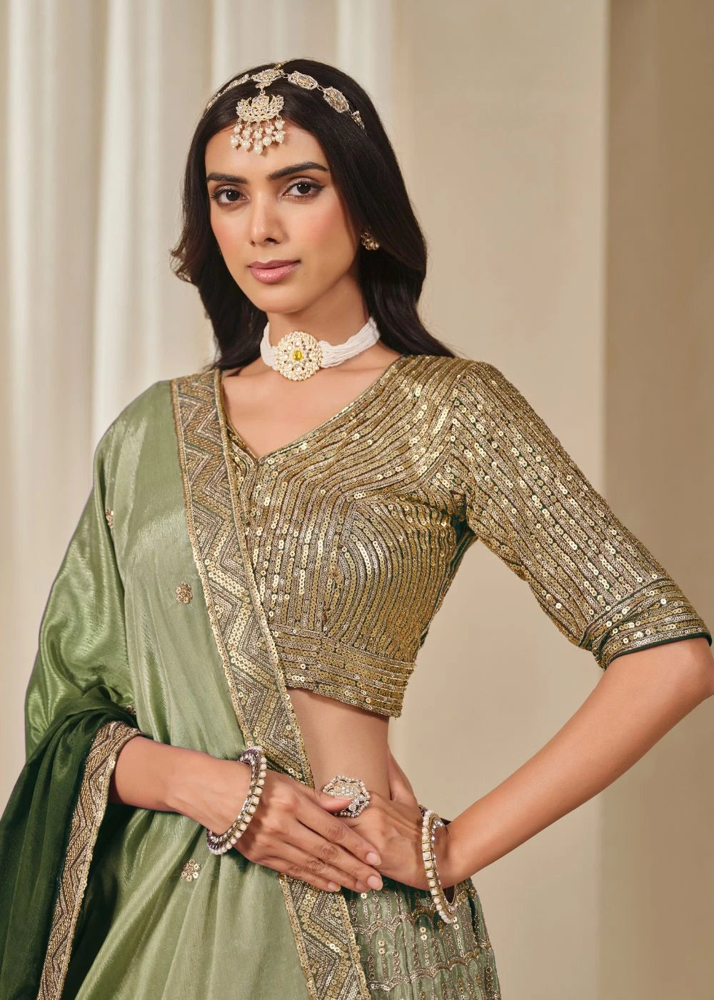 Emerald Royalty – Enchanted Green Chinon Silk Lehenga with Golden Zari Grandeur