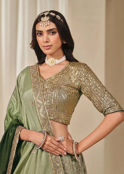 Emerald Royalty – Enchanted Green Chinon Silk Lehenga with Golden Zari Grandeur