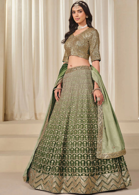Emerald Royalty – Enchanted Green Chinon Silk Lehenga with Golden Zari Grandeur