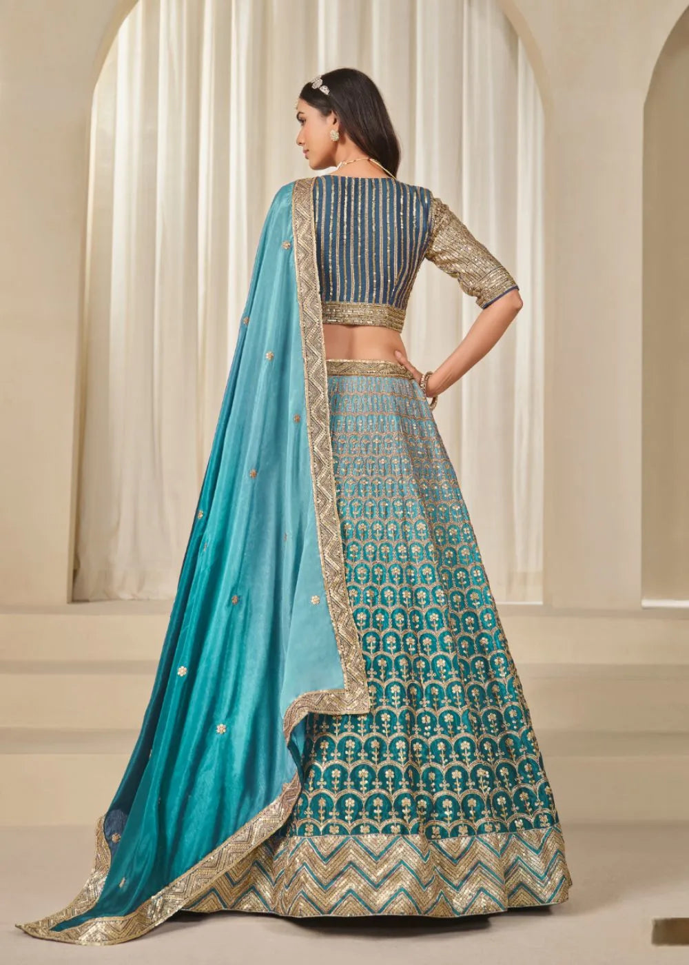 Oceanic Aura – Aqua Blue Chinon Silk Lehenga with Radiant Golden Weaves
