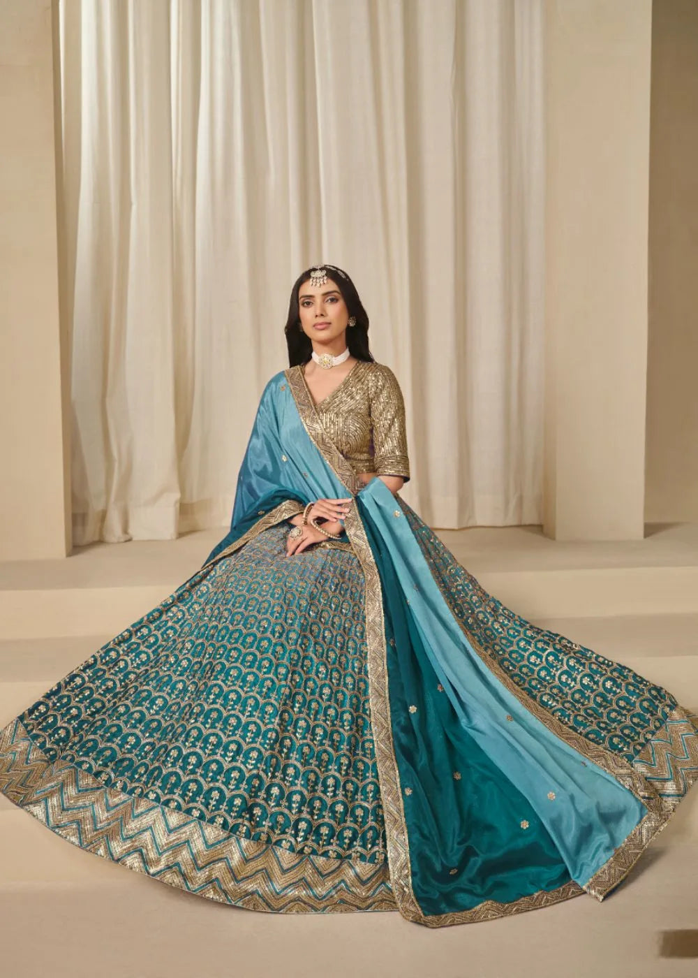 Oceanic Aura – Aqua Blue Chinon Silk Lehenga with Radiant Golden Weaves