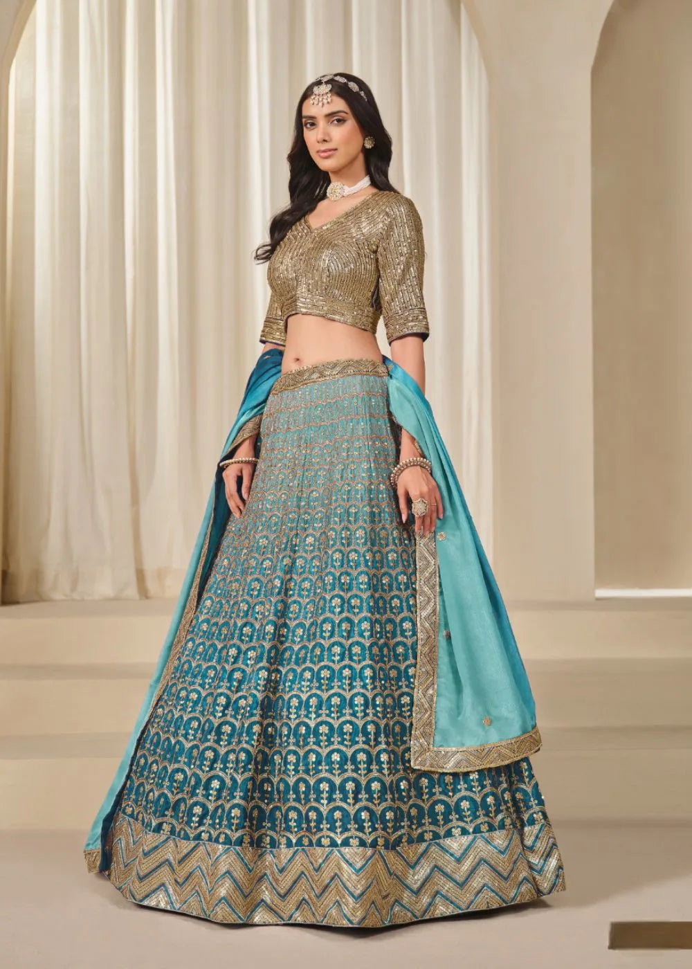 Oceanic Aura – Aqua Blue Chinon Silk Lehenga with Radiant Golden Weaves